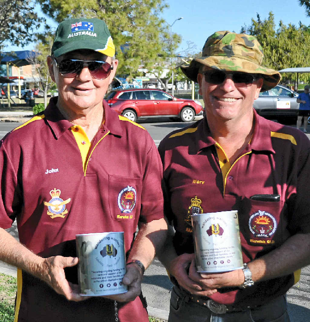 Ex-servicemen John Telfer and Merv Bray collect money following the parade.